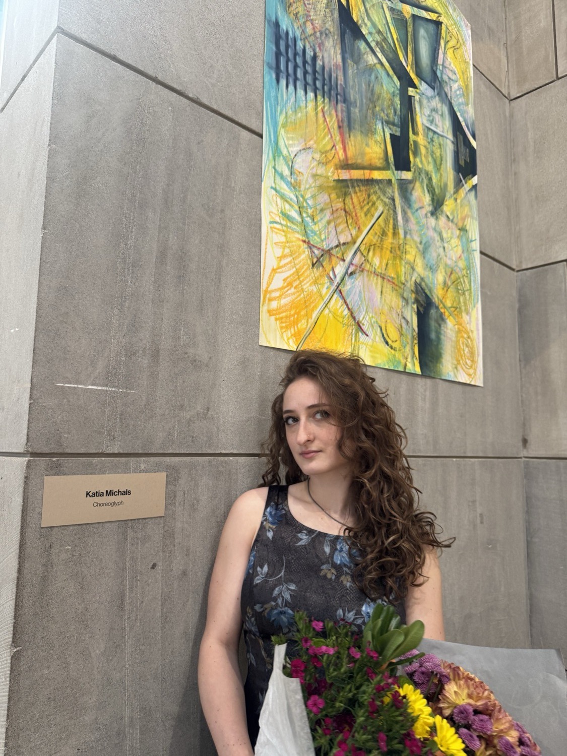 Katia at her recent show in Middletown, CT, beside one of her works
